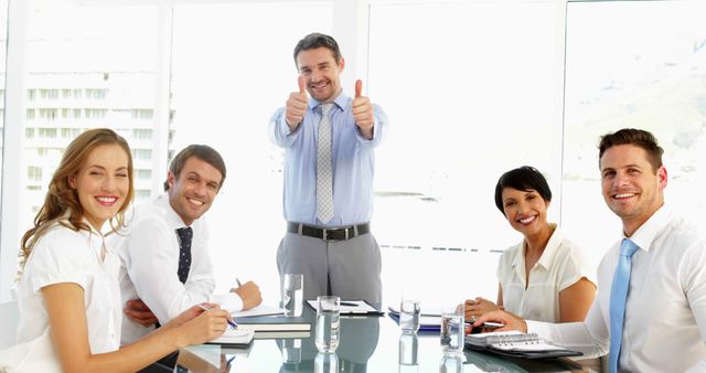 Team Meeting with Leader Giving Thumbs Up in Modern Office - Download Free Stock Images Pikwizard.com