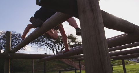 Athlete Conquering Wooden Obstacle Course Outdoors - Download Free Stock Images Pikwizard.com