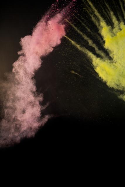 This image captures a dynamic explosion of color powder against a black background, creating a vibrant and energetic scene. Ideal for use in artistic projects, festival promotions, creative designs, and advertisements that require a burst of color and energy. Perfect for backgrounds, posters, and digital art.