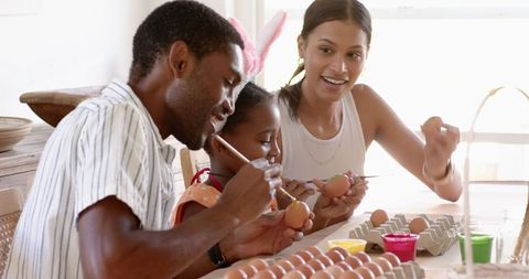 Family Today Creating Artistic Easter Eggs Together