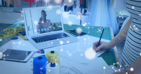 Fashion Designer Having Virtual Meeting in Vibrant Workspace