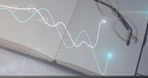 Notebook with grid overlay and eyeglasses for data visualization concepts
