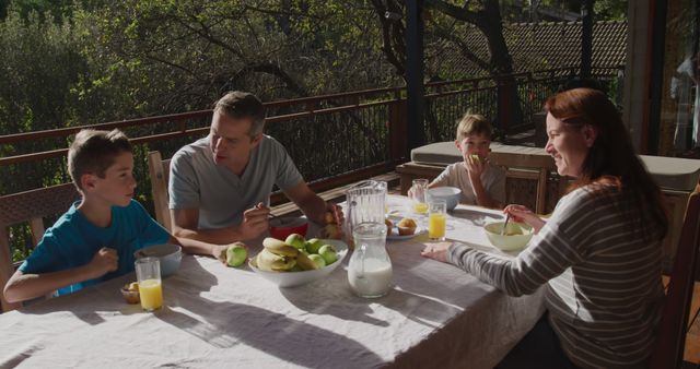 Family Enjoying Breakfast Outdoors on Sunny Day - Download Free Stock Images Pikwizard.com