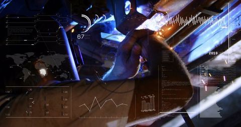 Welding technician operating torch on metal beam with futuristic HUD overlays and sparks