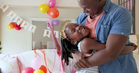 Joyful Family Birthday Celebration with Balloons and Laughter