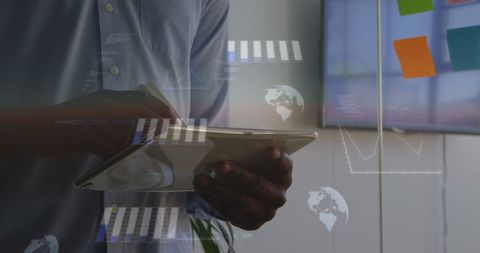 Professional analyzing business data on digital tablet in modern office