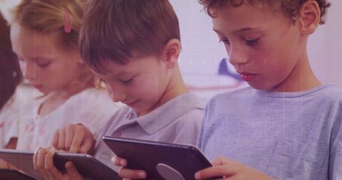 Engaged Schoolchildren Using Tablets in Classroom Learning