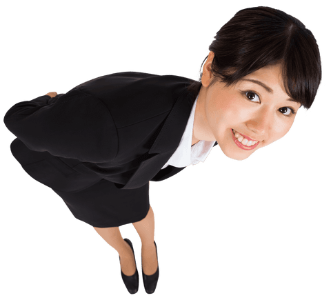 Asian businesswoman dressed in a black suit smiling brightly while maintaining eye contact on transparent background.