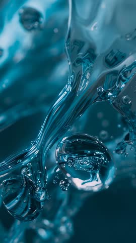 Macro teal filament forming rotating glossy droplets with drifting bubbles vertical video