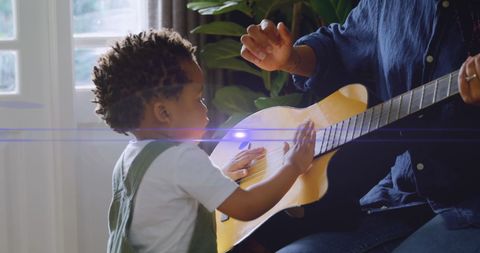 Mother and Son Bonding Through Guitar Playing in Living Room - Download Free Stock Images Pikwizard.com