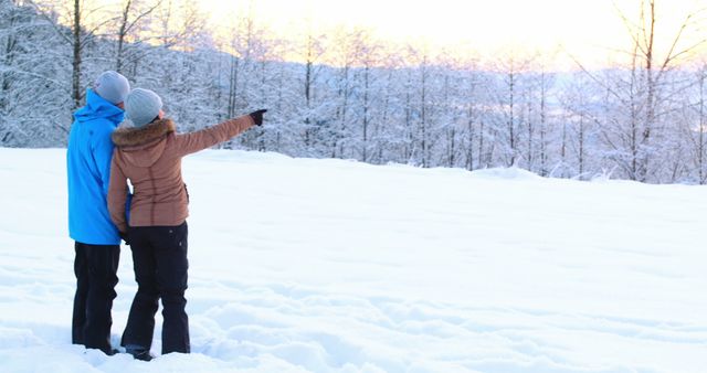 Couple Exploring Winter Landscape in Snowy Forest at Dawn - Download Free Stock Images Pikwizard.com