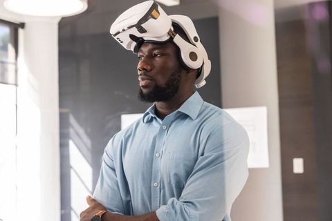 Business Professional Engaging with Futuristic VR Technology in Office