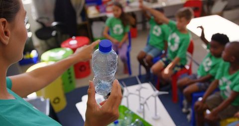 Teacher Guiding Diverse Children in Recycling Lesson, Engaging Classroom Activity - Download Free Stock Images Pikwizard.com