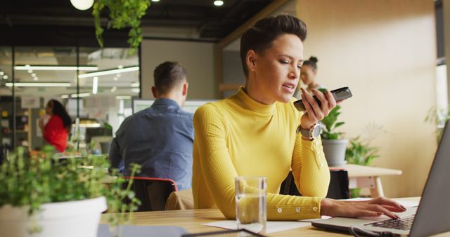 Businesswoman Using Voice Recorder in Modern Office - Download Free Stock Images Pikwizard.com