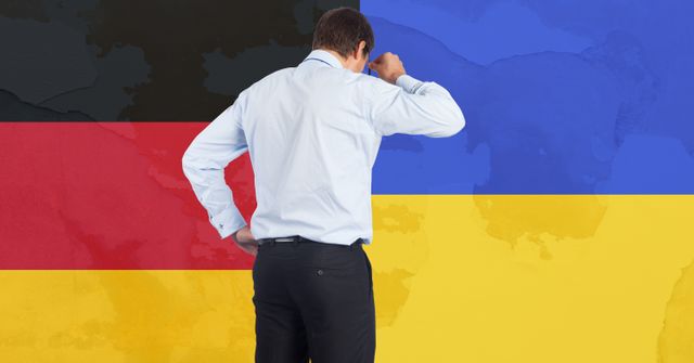 Rear view of stressed caucasian businessman against germany and ukraine flag design background. ukraine crisis, invasion and international relations concept