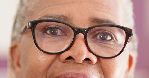 Senior individual wearing eyeglasses willi deep contemplation