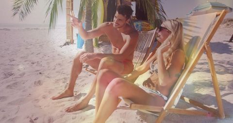 Relaxing Beach Conversation in Warm Sunlight at Tropical Shoreline