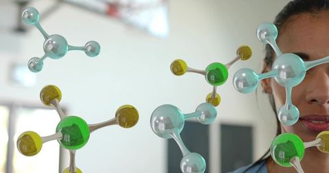 Scientist examining holographic molecular models in modern lab for biotech innovation