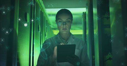 Engineer Analyzing Data on Digital Tablet in Futuristic Server Room - Download Free Stock Images Pikwizard.com