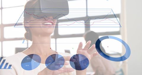 Businesswoman Using VR Headset with Virtual Infographics in Modern Office - Download Free Stock Images Pikwizard.com