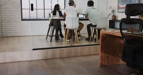 Team discussing strategy in modern office conference room