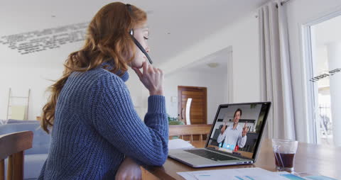 Woman Participating in Video Call at Home Office Desk