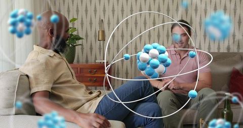 Two Men Interacting with Augmented Reality Molecular Hologram on Living Room Sofa for STEM