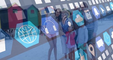 Family Bonding on Beach Overlaid with Digital Technology Icons