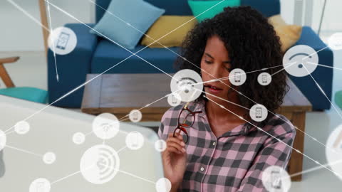 Digital Network Interfaces and Businesswoman on Laptop