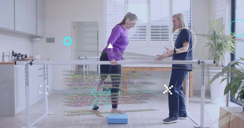 Woman Practicing Balance Therapy with Physical Therapist in Modern Rehab Space