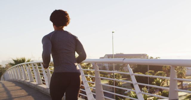 Athlete Running on Urban Bridge at Sunrise - Download Free Stock Images Pikwizard.com