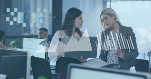 Colleagues Analyzing Financial Data with Digital Interface