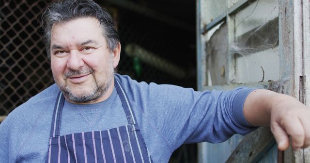 Middle-aged Male Chef Wearing Apron Relaxing Outside Kitchen - Download Free Stock Images Pikwizard.com