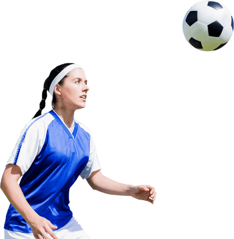 Focused woman soccer player eyeballing ball on transparent background