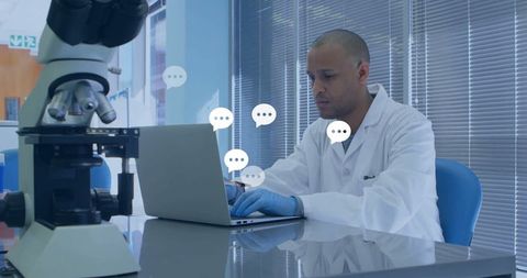 Laboratory scientist analyzing data on laptop