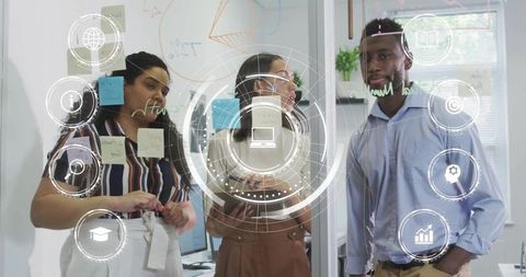 Diverse team brainstorming on glass wall with sticky notes and futuristic hud interface