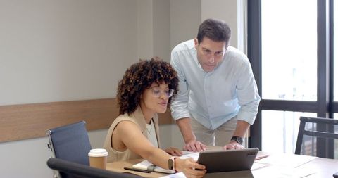 Diverse Coworkers Collaborating on Business Presentation