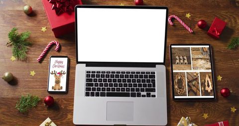 Festive Workspace with Gadgets and Christmas Decorations - Download Free Stock Images Pikwizard.com