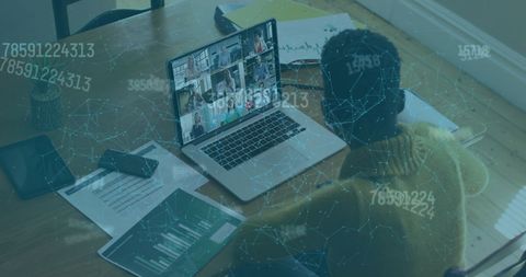 Woman Analyzing Data on Laptop with Cybersecurity Overlay