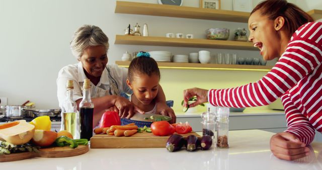 Mother, Grandmother, and Daughter Cooking Together in Modern Kitchen - Download Free Stock Images Pikwizard.com