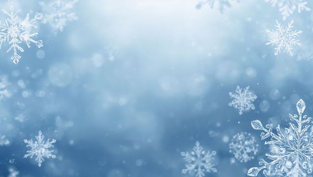 Drifting crystal snowflakes on soft blue bokeh background for winter holiday designs