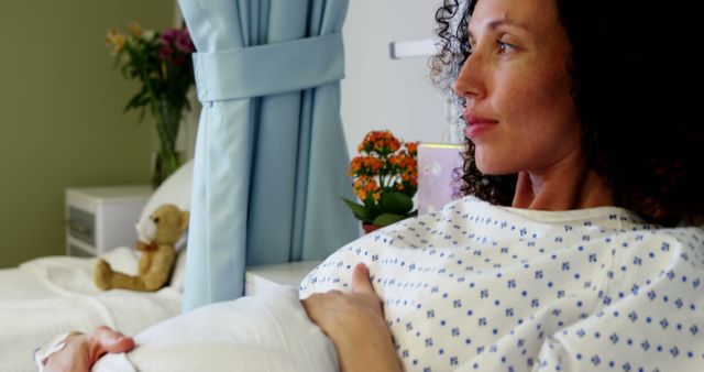 Pregnant Woman Looking Peacefully in Hospital Room - Download Free Stock Images Pikwizard.com