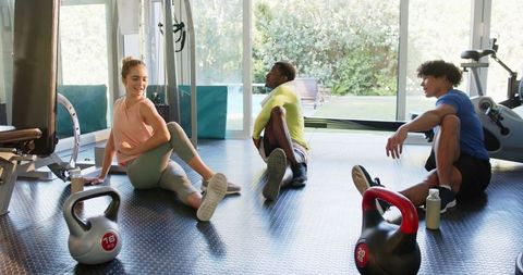 Empowered workout: group stretching and kettlebell session