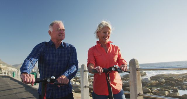 Happy Senior Couple Enjoying Outdoor Electric Scooter Ride by Beach - Download Free Stock Images Pikwizard.com