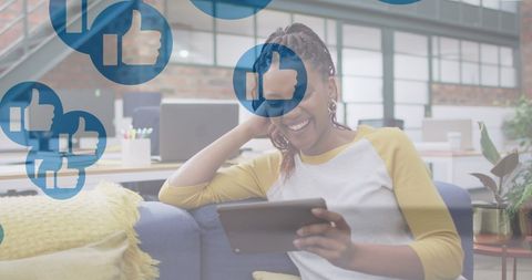 Businesswoman Engaging with Online Social Media Through Tablet