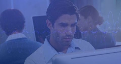 Business Professional Analyzing Digital Waves in Office