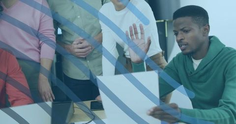 Team Collaboration Analyzing Document in Modern Office