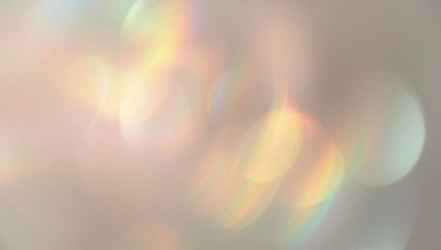 Dreamy pastel bokeh lights on soft neutral background