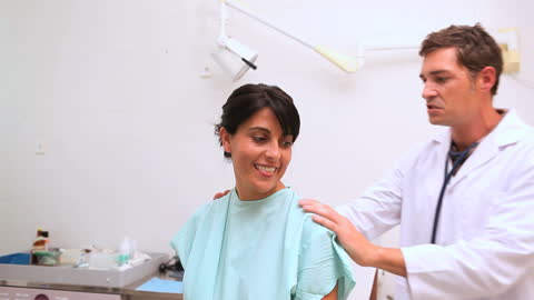 Doctor Examining Patient in Clinical Setting