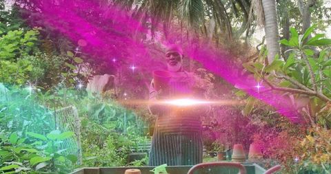 Black Gardener Inspecting Clay Pot in Lush Tropical Garden with Colorful Light Streaks